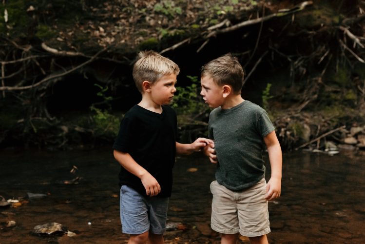 Boys talking intently